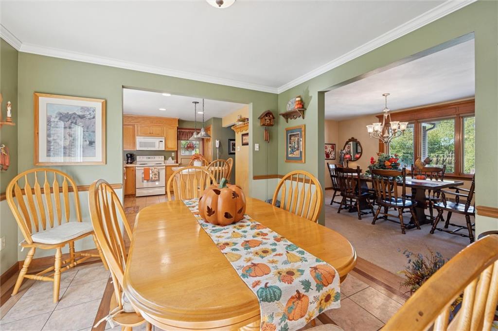 4941 Bulltown Road Murrysville, PA 15668 - Photo 11 of 39 a view of a dining room with furniture window and outside view