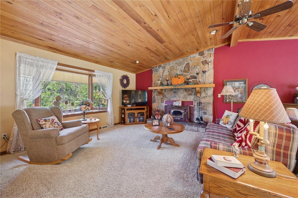 4941 Bulltown Road Murrysville, PA 15668 - Photo 20 of 39 a living room with furniture and a fireplace