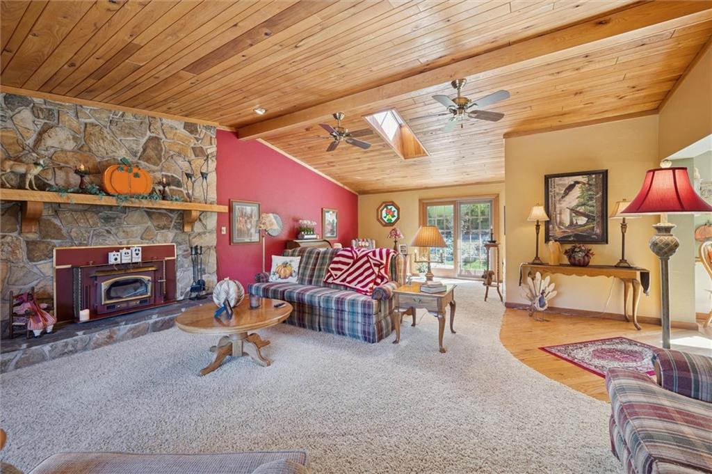4941 Bulltown Road Murrysville, PA 15668 - Photo 22 of 39 a living room with furniture and a fireplace