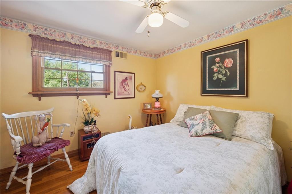 4941 Bulltown Road Murrysville, PA 15668 - Photo 23 of 39 a bedroom with a bed and chair