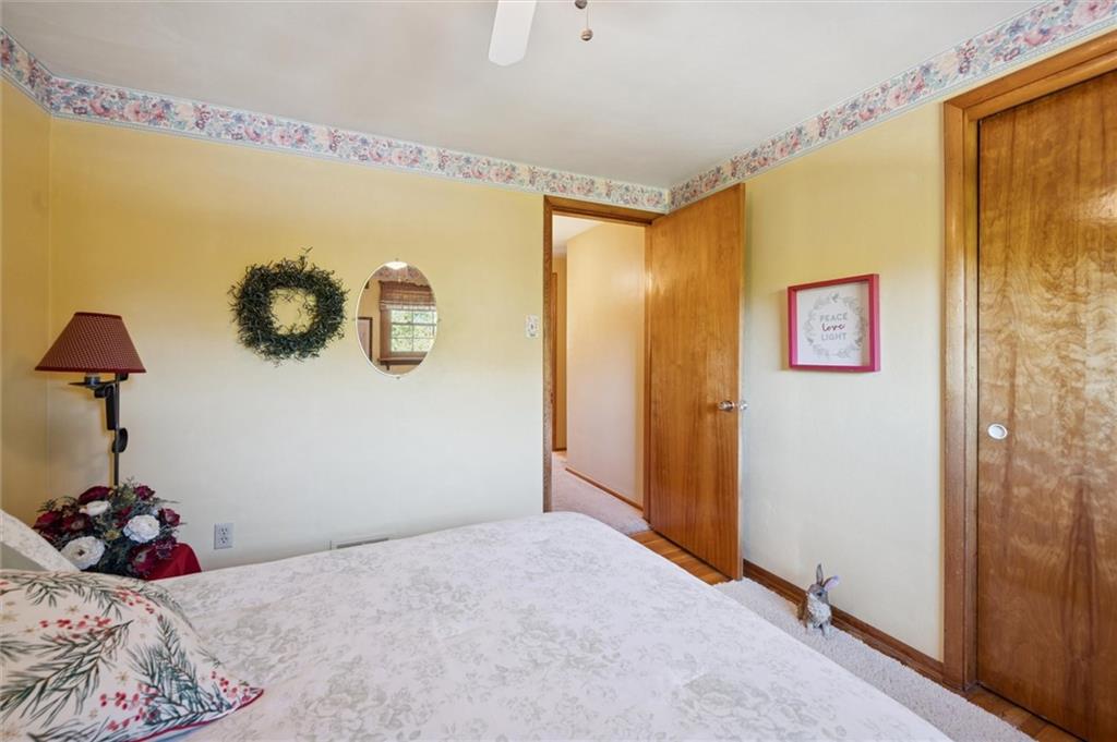 4941 Bulltown Road Murrysville, PA 15668 - Photo 24 of 39 a bedroom with a bed and a table