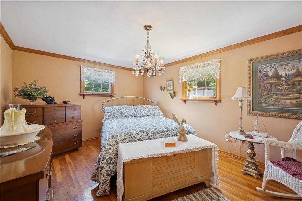 4941 Bulltown Road Murrysville, PA 15668 - Photo 26 of 39 a living room with furniture and a chandelier
