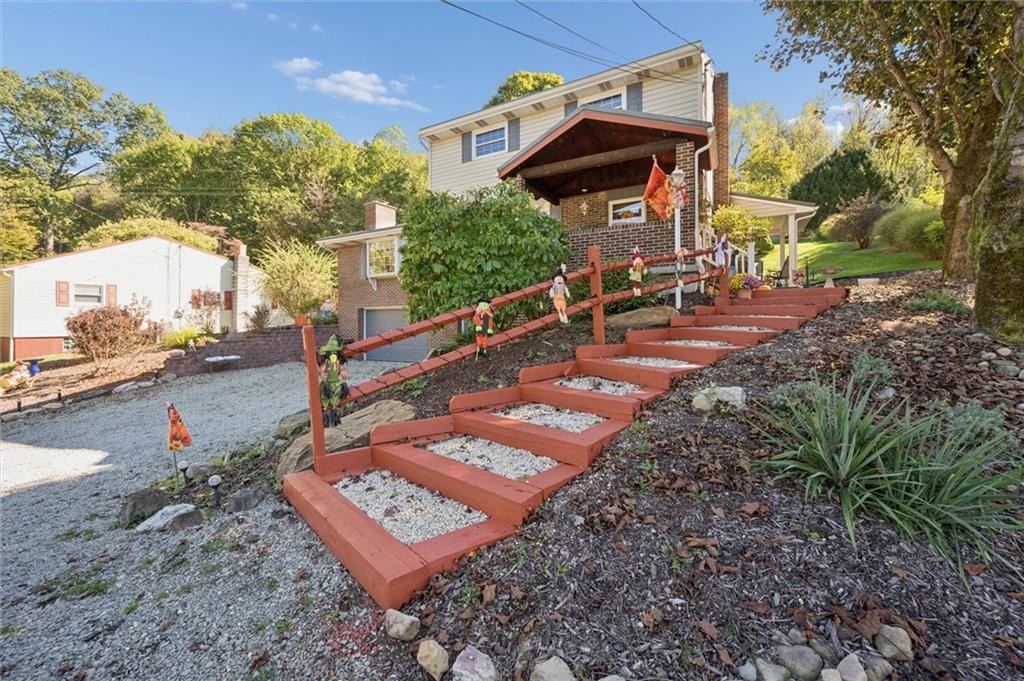 4941 Bulltown Road Murrysville, PA 15668 - Photo 3 of 39 a view of a backyard with sitting area