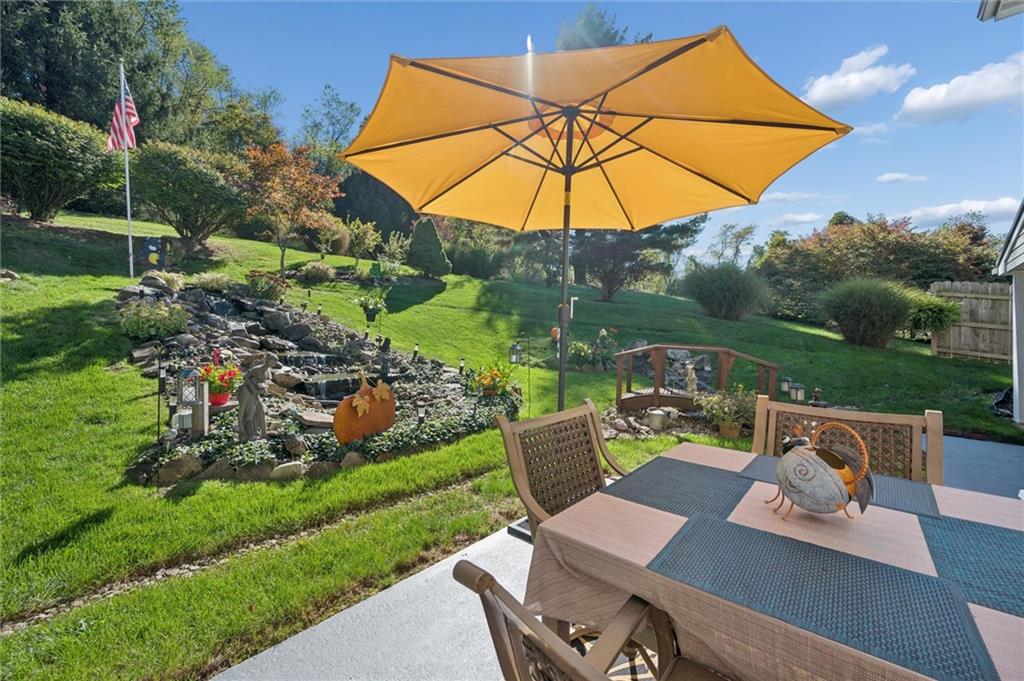 4941 Bulltown Road Murrysville, PA 15668 - Photo 32 of 39 a view of a chair and table on the garden