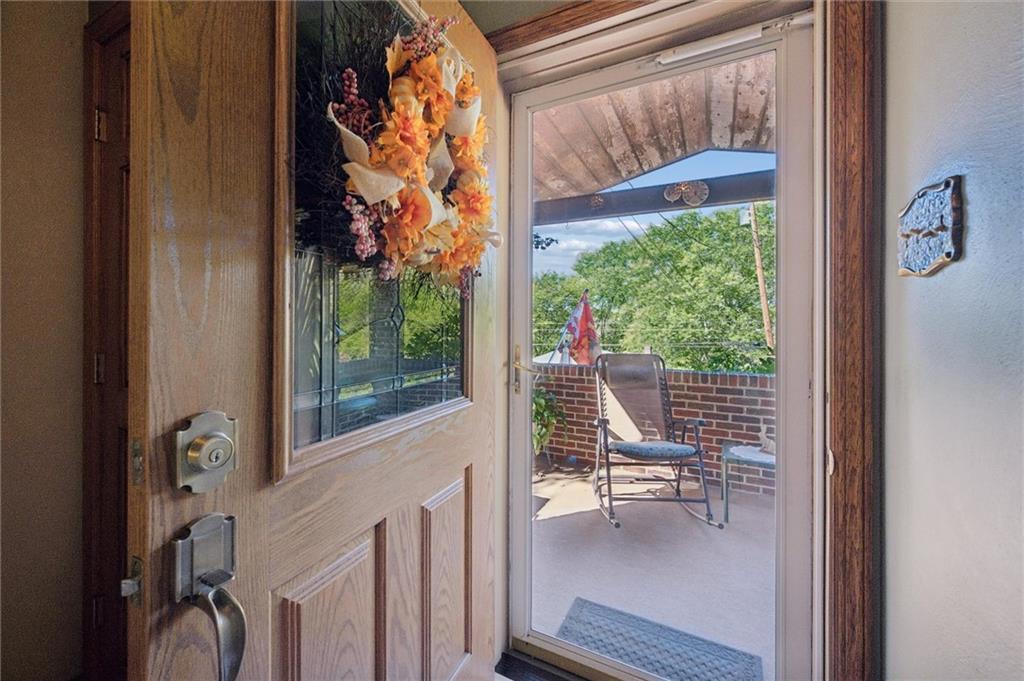 4941 Bulltown Road Murrysville, PA 15668 - Photo 7 of 39 a view of a chair and tables in the balcony
