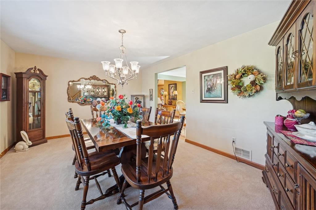 4941 Bulltown Road Murrysville, PA 15668 - Photo 8 of 39 a view of a dining room with furniture and chandelier