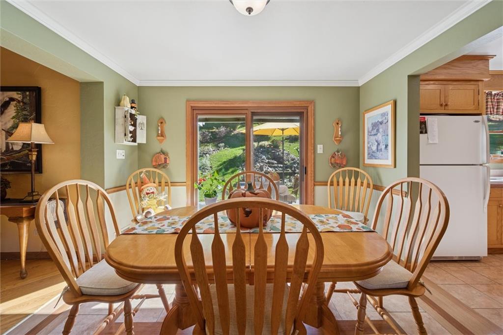 4941 Bulltown Road Murrysville, PA 15668 - Photo 10 of 39 a view of a dining room with furniture window and wooden floor
