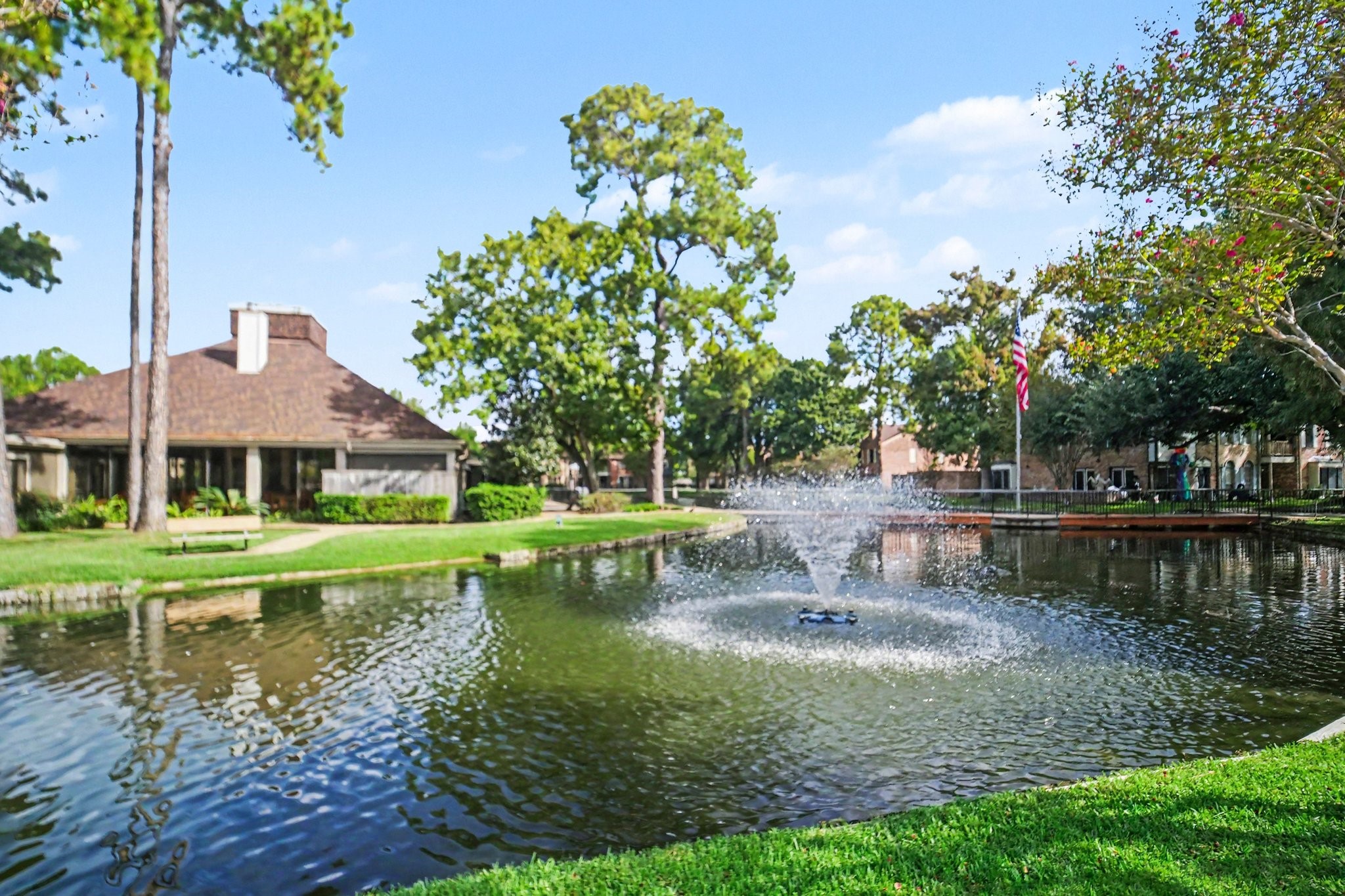 5801 Lumberdale Road, Unit 78 Houston, TX 77092 - Photo 33 of 35 Enjoy serene lakeside views at the community clubhouse, where relaxation and picturesque scenery await.