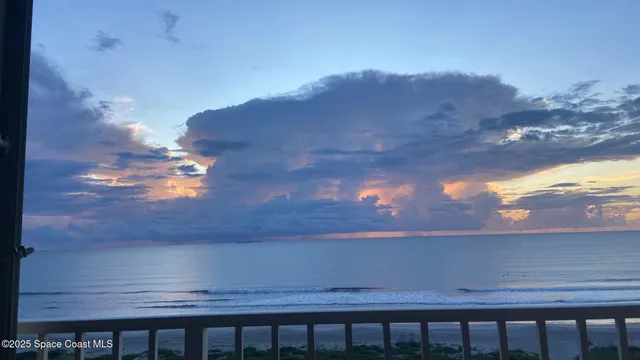 a view of a yard from a balcony