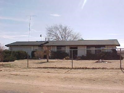 20957 Quileute Road Apple Valley, CA 92308 - Photo 1 of 1 a front view of a house