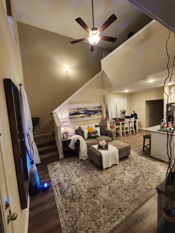 a living room with furniture fireplace and flat screen tv