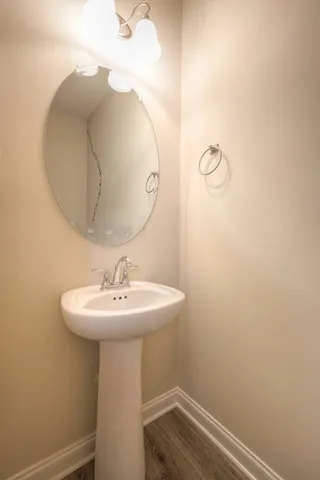 a bathroom with a sink and mirror