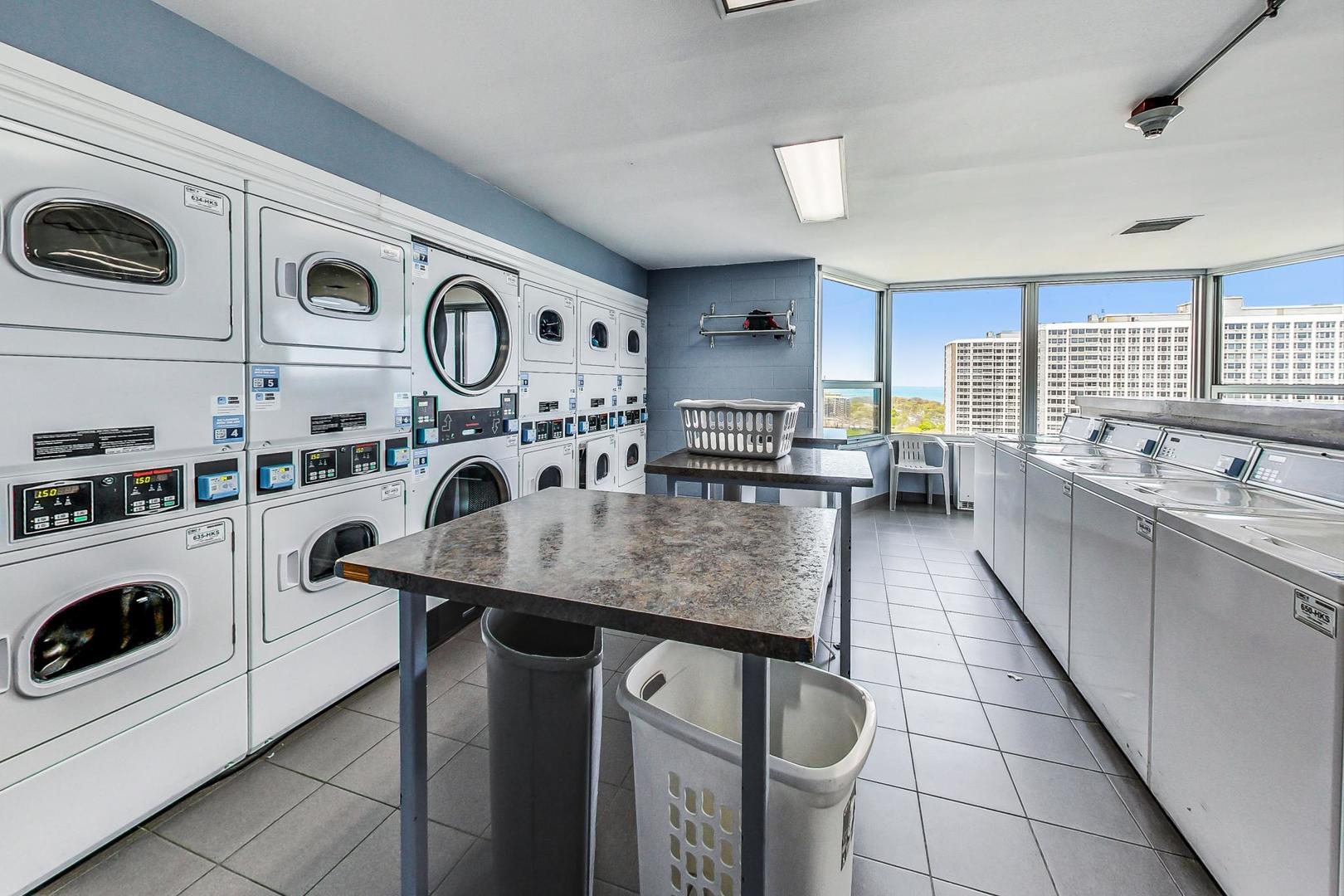 720 West Gordon Terrace, Unit 6D Chicago, IL 60613 - Photo 24 of 28 a kitchen with stainless steel appliances granite countertop a sink and a stove top oven
