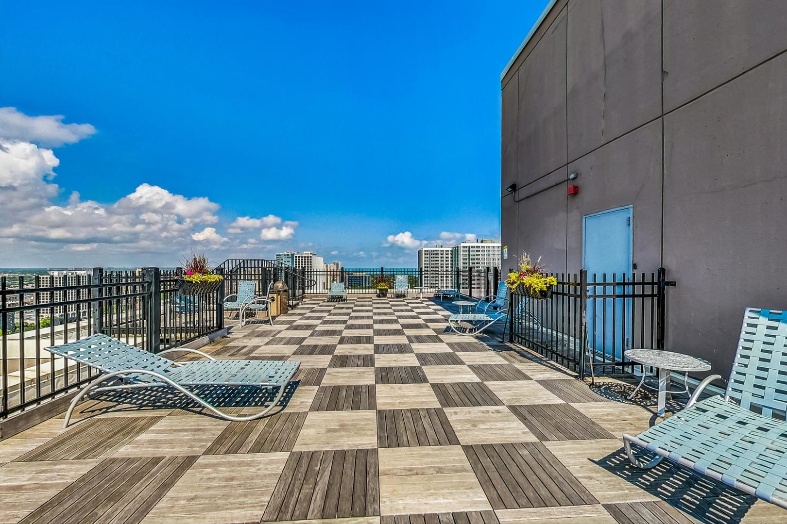 720 West Gordon Terrace, Unit 6D Chicago, IL 60613 - Photo 27 of 28 a view of a balcony with wooden floor