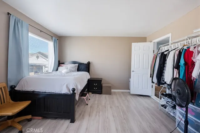 a bed room with a bed and a window