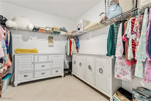 a view of a storage & utility room with cabinets