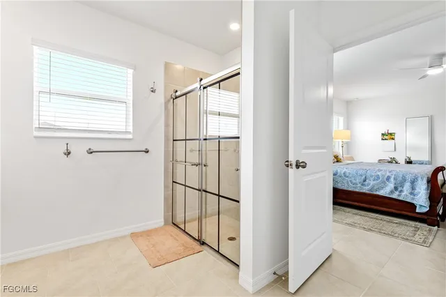 a view of a bedroom with furniture and windows