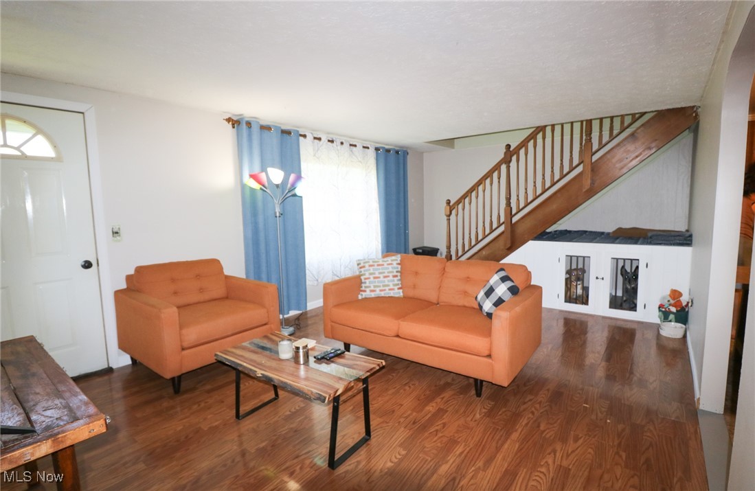 36751 Sugar Ridge Road North Ridgeville, OH 44039 - Photo 3 of 22 Living area featuring stairway and wood finished floors