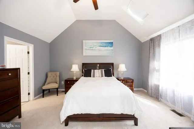 a bedroom with a bed and chair