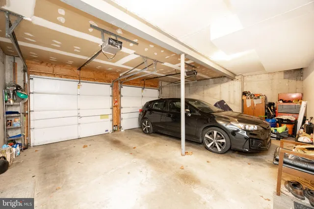 a view of a garage with parked cars