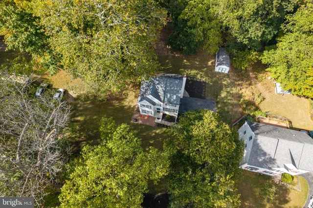 a view of a small house with backyard