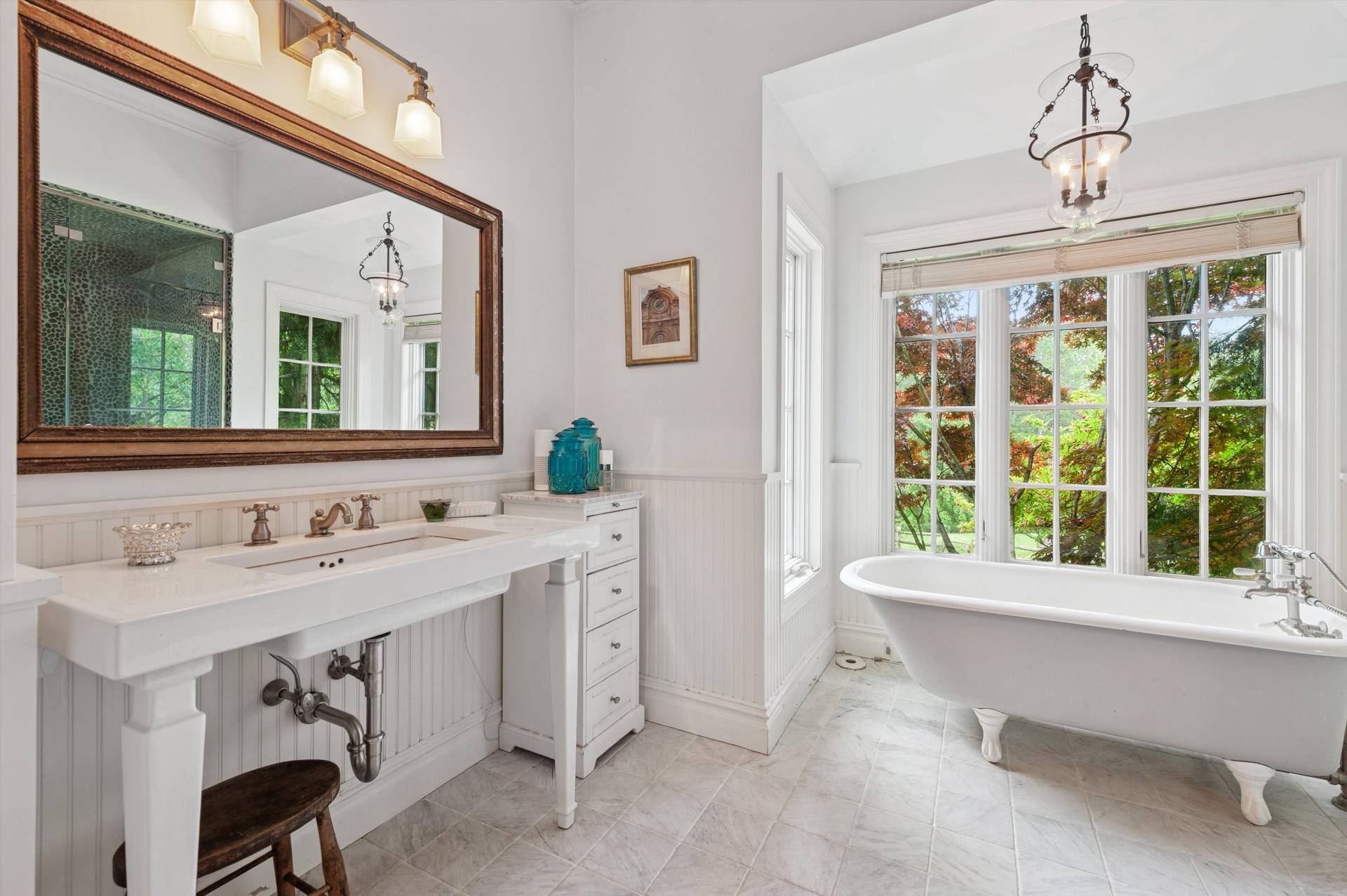 200 Great Hill Road Southampton, NY 11968 - Photo 13 of 44 a bathroom with a granite countertop sink and a large mirror