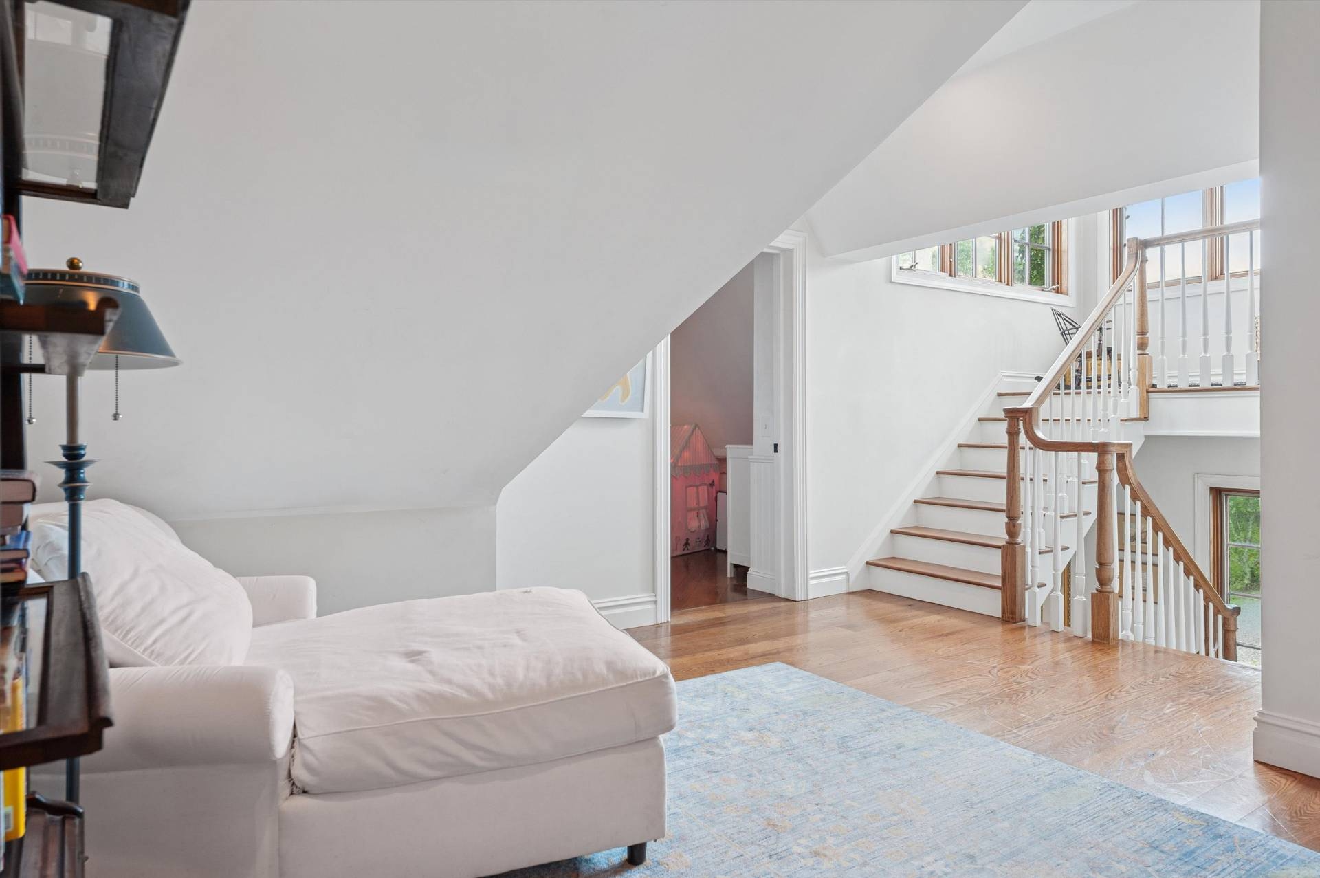 200 Great Hill Road Southampton, NY 11968 - Photo 17 of 44 a living room with furniture and stairs