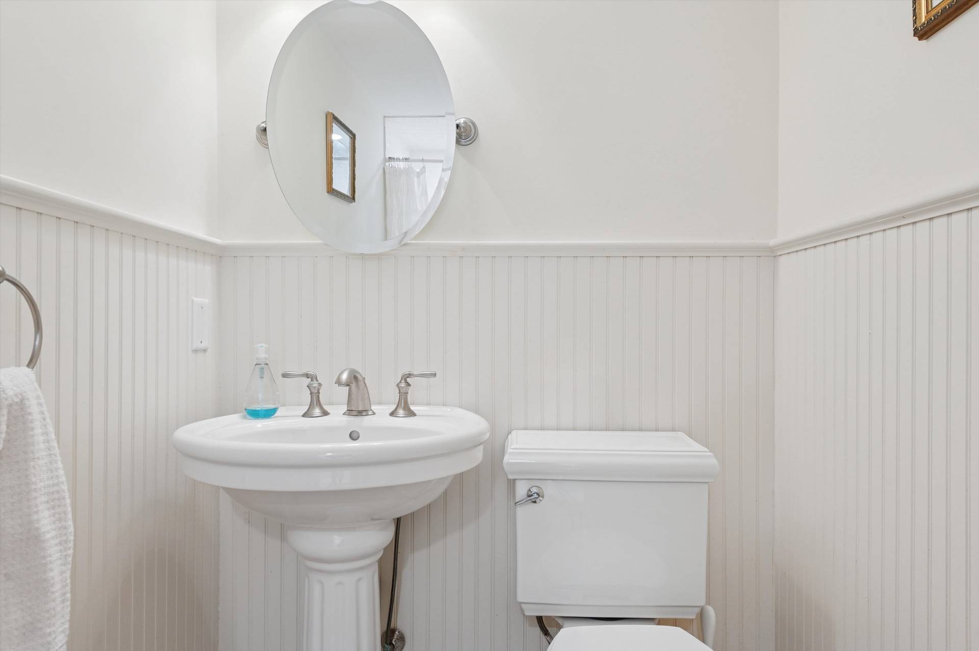 200 Great Hill Road Southampton, NY 11968 - Photo 18 of 44 a bathroom with a sink a toilet and a mirror