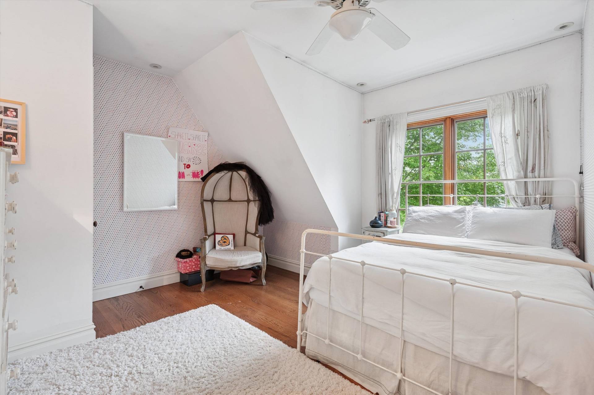 200 Great Hill Road Southampton, NY 11968 - Photo 23 of 44 a bedroom with a bed and a chandelier