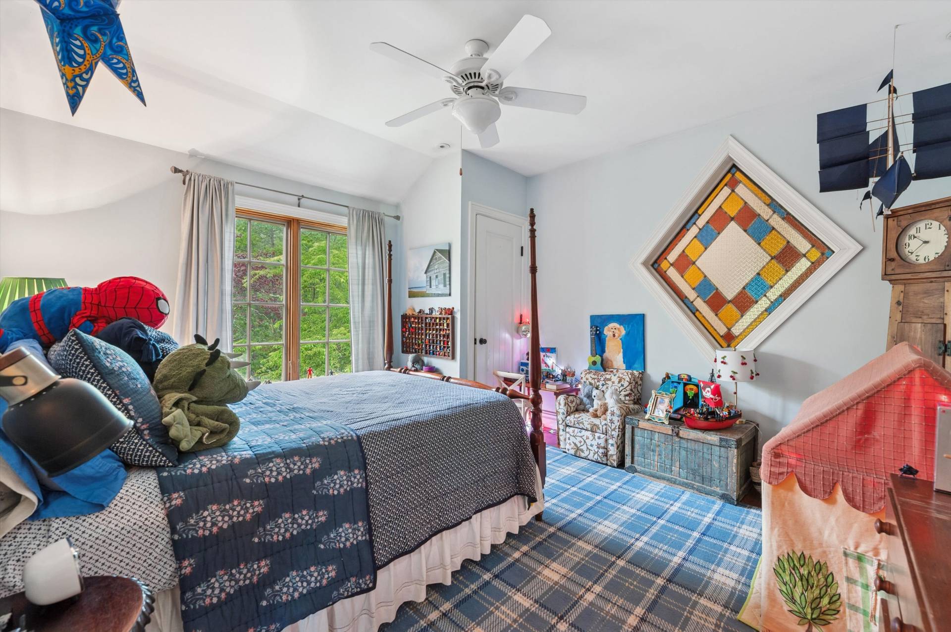 200 Great Hill Road Southampton, NY 11968 - Photo 26 of 44 a bedroom with a bed and a chandelier