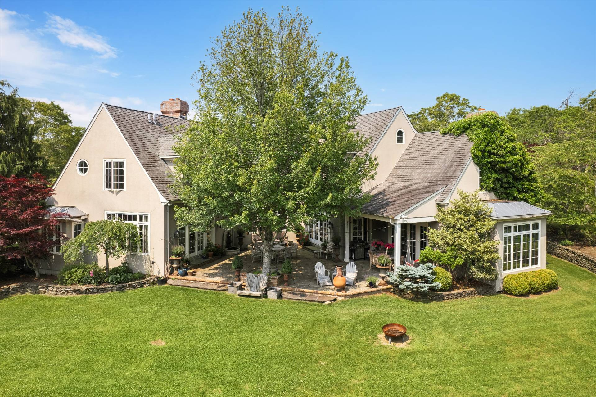 200 Great Hill Road Southampton, NY 11968 - Photo 30 of 44 a view of a house with backyard porch and furniture