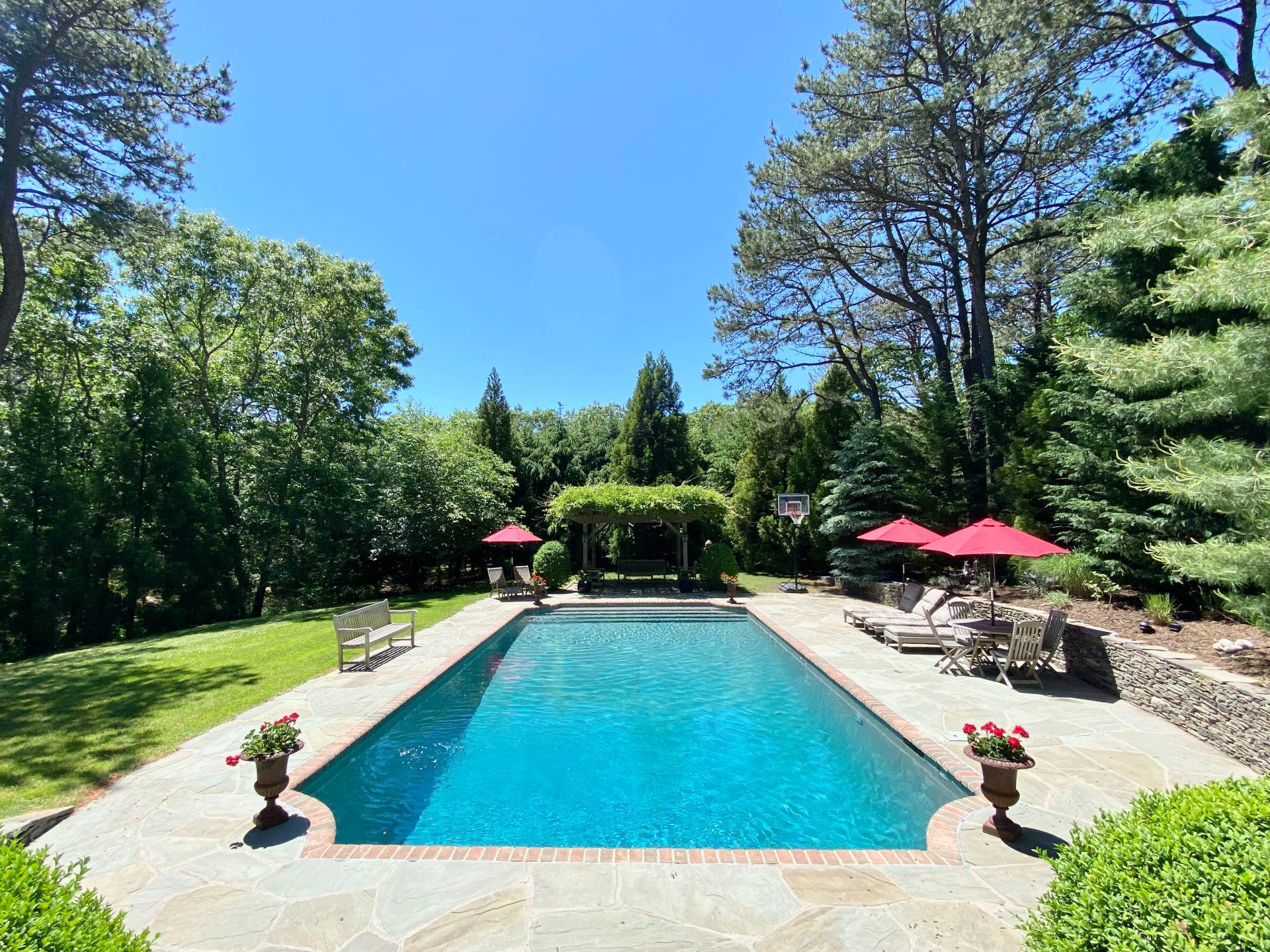 200 Great Hill Road Southampton, NY 11968 - Photo 32 of 44 a view of a tennis ground with large trees