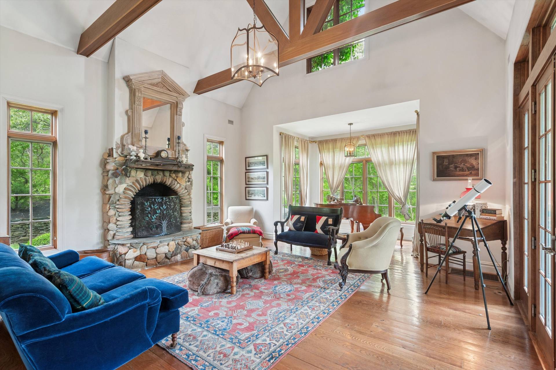 200 Great Hill Road Southampton, NY 11968 - Photo 5 of 44 a living room with furniture a large window and a fireplace