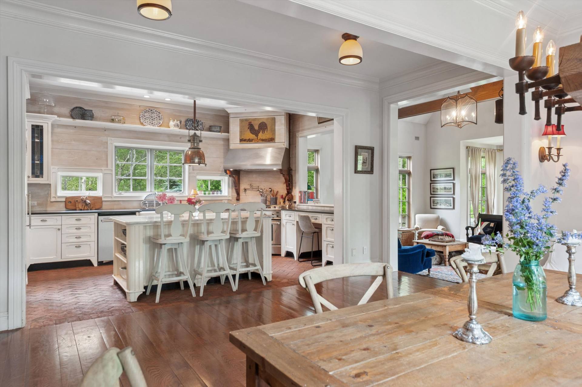 200 Great Hill Road Southampton, NY 11968 - Photo 7 of 44 a living room with lots of furniture and a chandelier