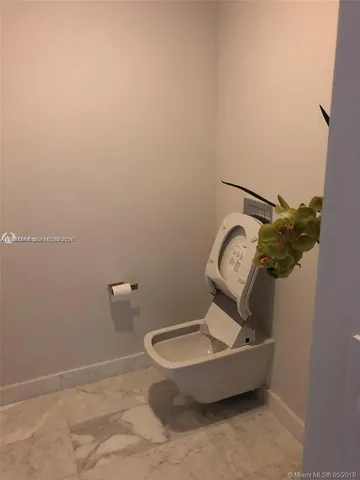 a bathroom with a toilet and a sink