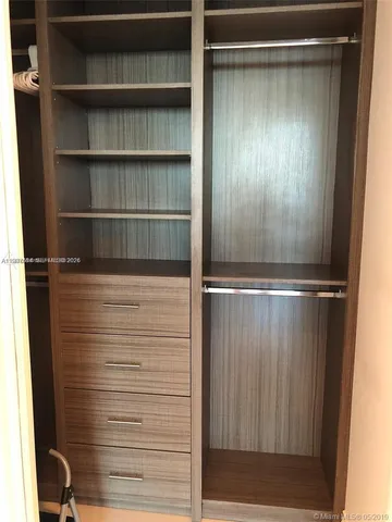 a bathroom with a glass door