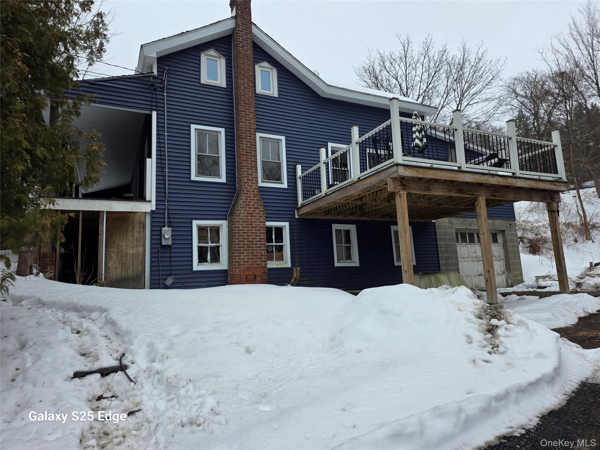 1014 Rte 44 55 Clintondale, NY 12515 - Photo 1 of 45 a view of a house with a yard covered in snow