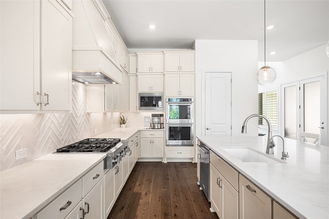 4114 Pleasant Ridge Drive Spring, TX 77386 - Photo 11 of 48 Generous cabinetry extends all the way to the ceiling, maximizing storage while enhancing both functionality and a polished, streamlined look.