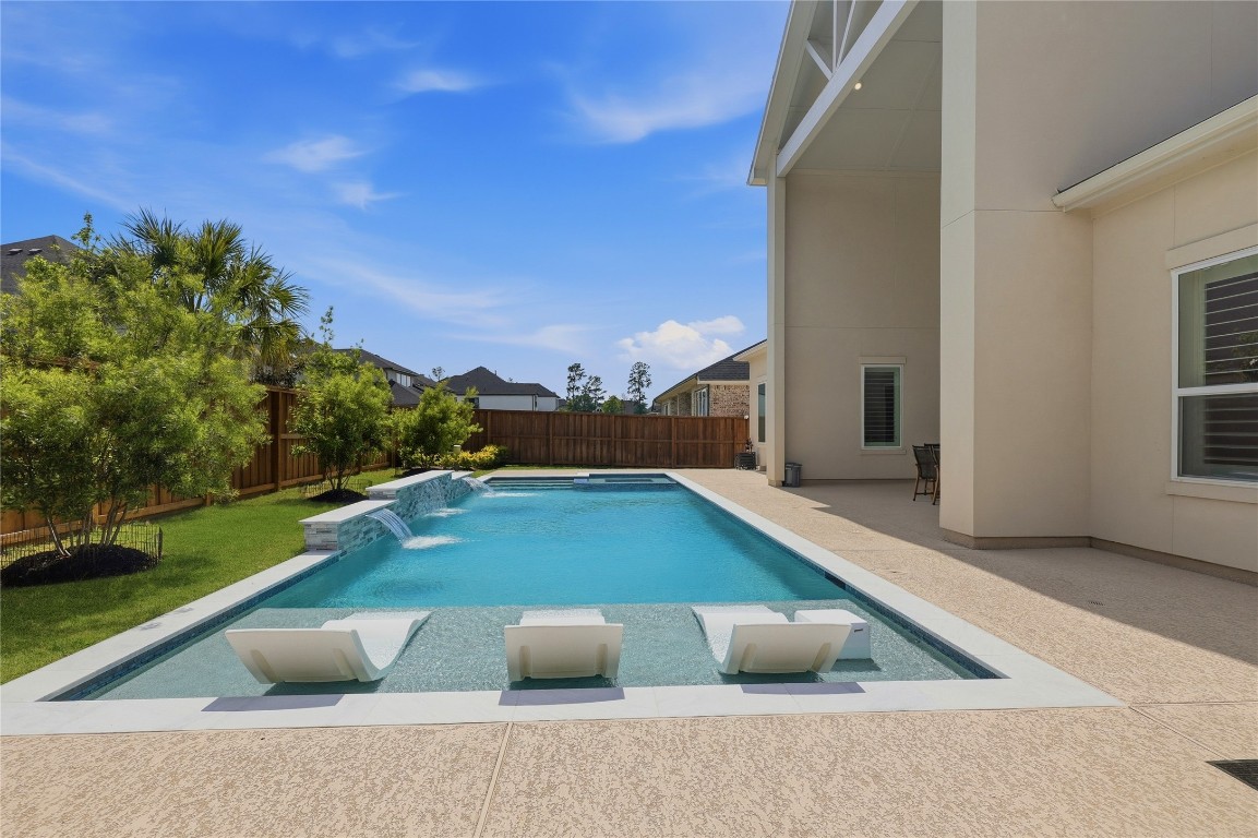 4114 Pleasant Ridge Drive Spring, TX 77386 - Photo 18 of 48 Sports Pool with tanning ledge and spa. This pool includes a heater and chiller!