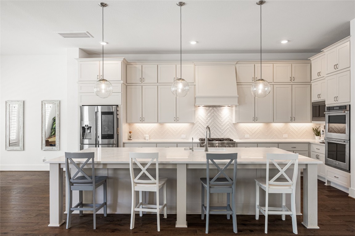 4114 Pleasant Ridge Drive Spring, TX 77386 - Photo 10 of 48 High-end kitchen featuring upgraded appliances that blend luxury, performance, and modern design.