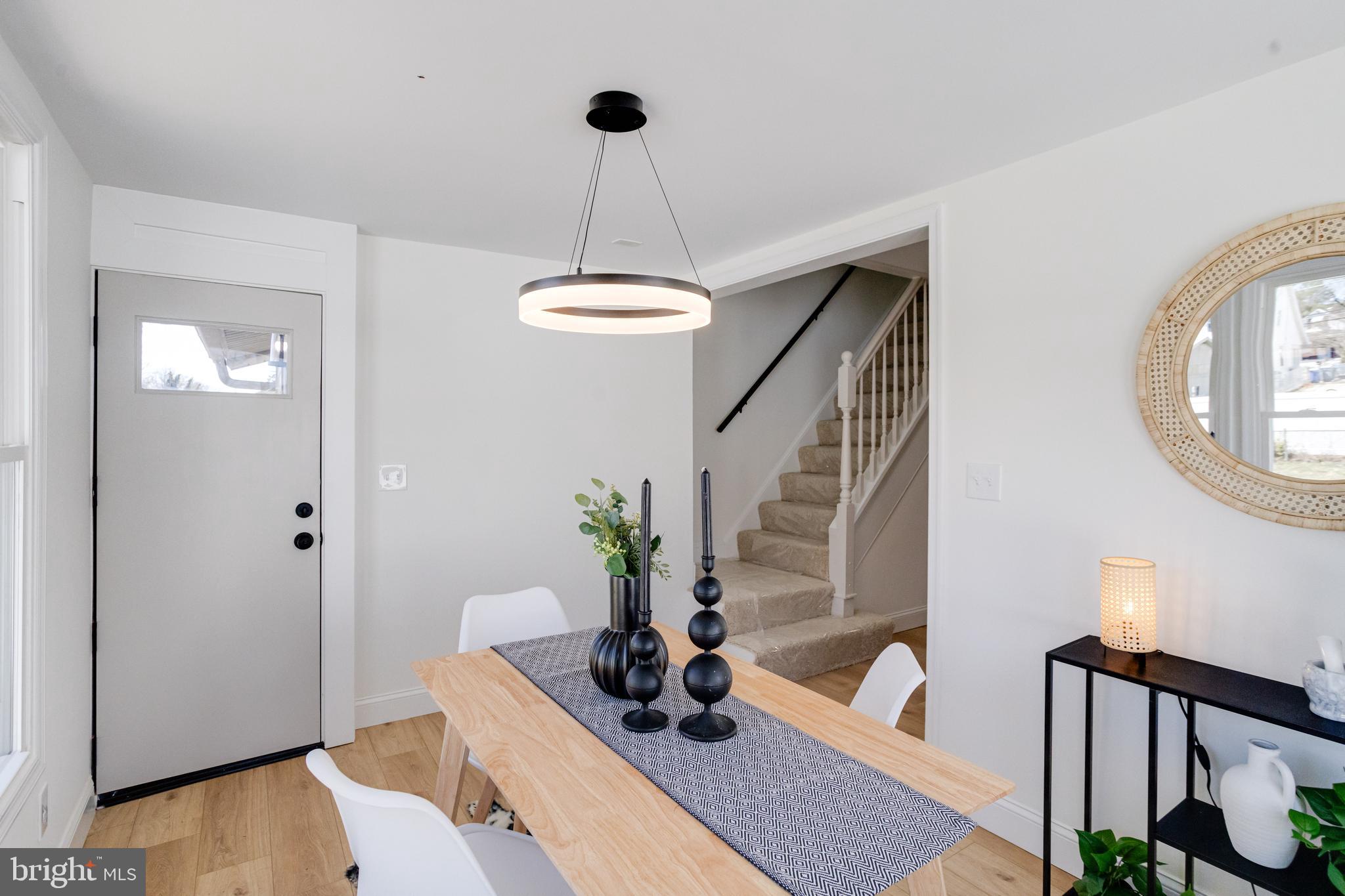 1729 Winans Avenue Halethorpe, MD 21227 - Photo 13 of 40 a living room with furniture and a chandelier