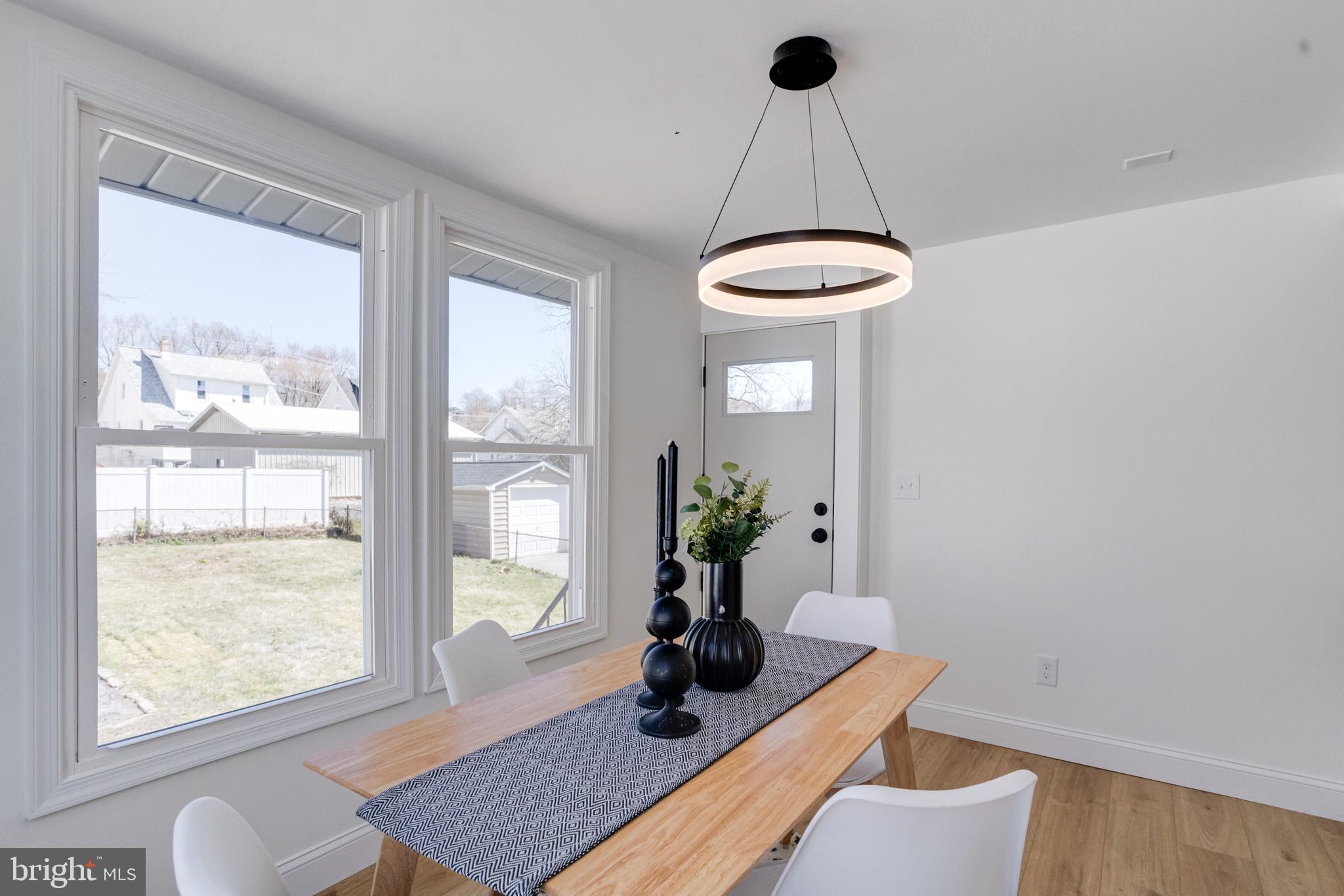 1729 Winans Avenue Halethorpe, MD 21227 - Photo 14 of 40 a living room with a bath tub and a large window