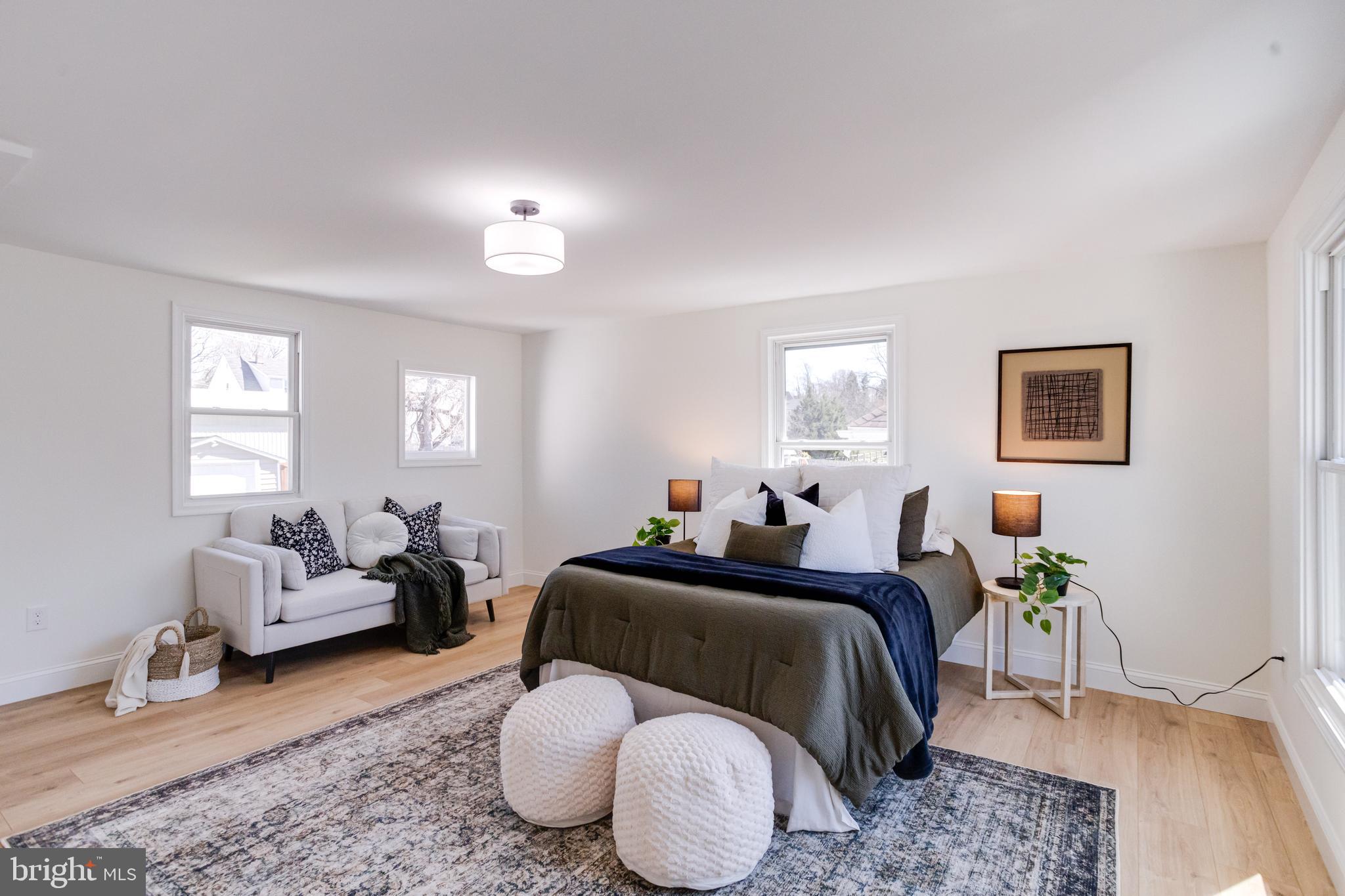 1729 Winans Avenue Halethorpe, MD 21227 - Photo 16 of 40 a bedroom with a bed couches chair and a window