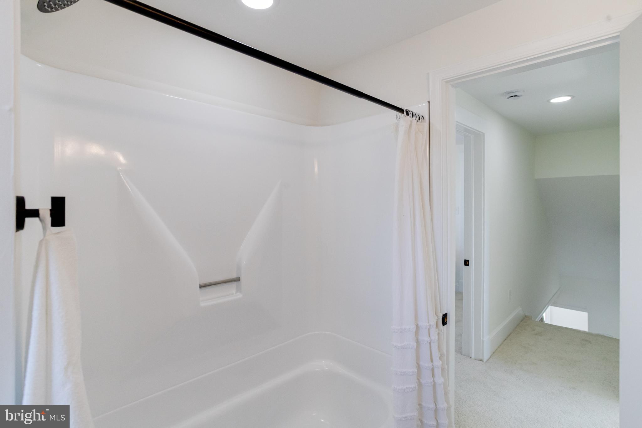 1729 Winans Avenue Halethorpe, MD 21227 - Photo 31 of 40 a bathroom with a shower and a glass door