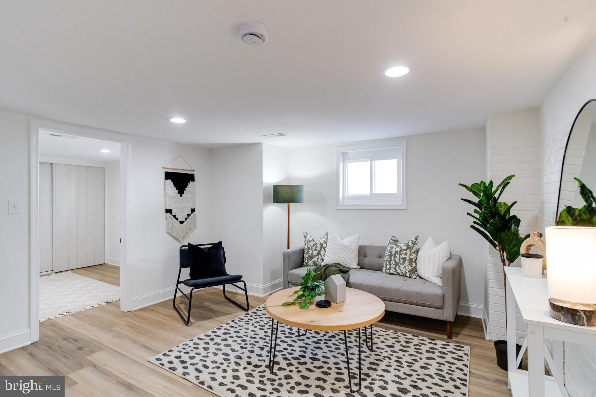 1729 Winans Avenue Halethorpe, MD 21227 - Photo 32 of 40 a living room with furniture and a potted plant