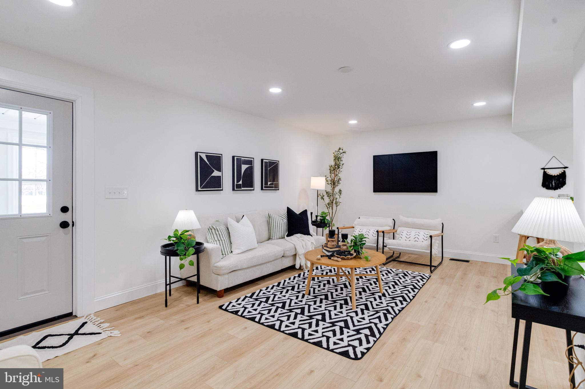 1729 Winans Avenue Halethorpe, MD 21227 - Photo 5 of 40 a living room with furniture and a flat screen tv