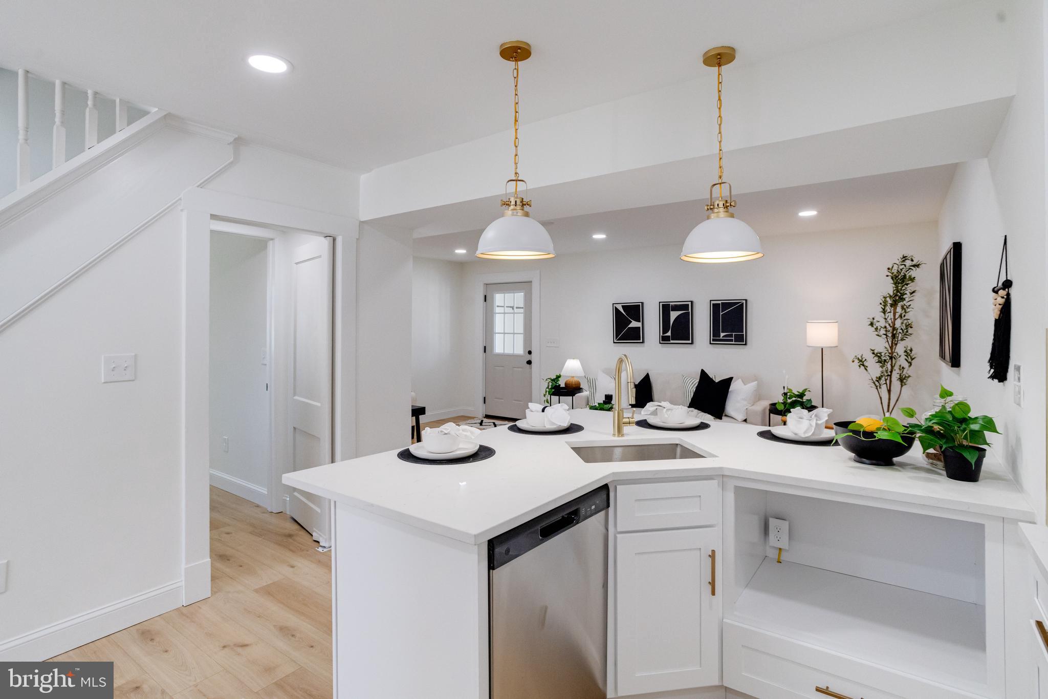 1729 Winans Avenue Halethorpe, MD 21227 - Photo 10 of 40 a view of a kitchen island a sink and microwave