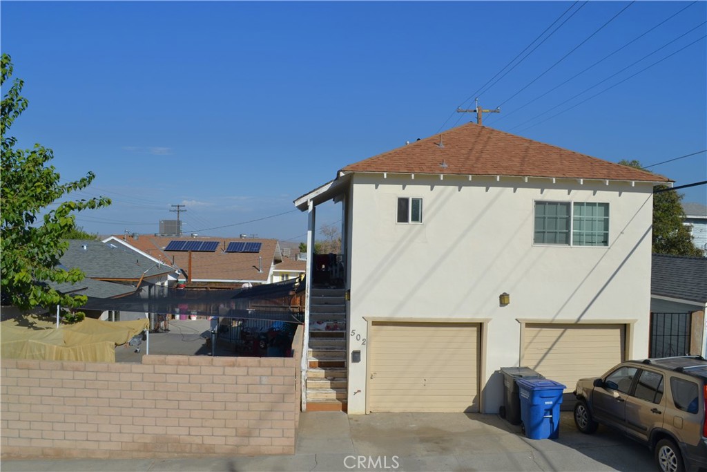 431 E Street Taft, CA 93268 - Photo 7 of 12 a front view of a house with a garage