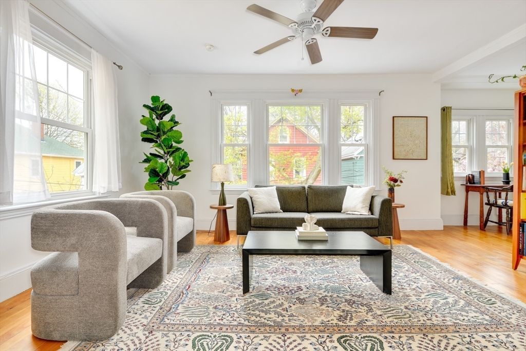 48 Crescent Street, Unit 2 Cambridge, MA 02138 - Photo 1 of 17 a living room with furniture and a large window