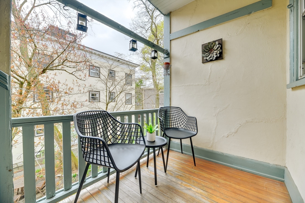 48 Crescent Street, Unit 2 Cambridge, MA 02138 - Photo 16 of 17 a view of a chairs and table in the balcony